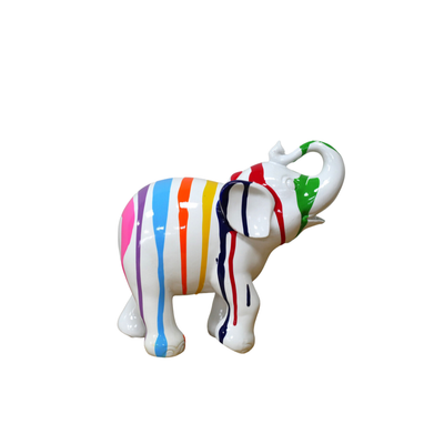 Side view on a shelf of this magnificent elephant is sculpted from clear white resin with rainbow colours of paint dripping down his entire body! A standing trumpeting stance. Height 18 cm