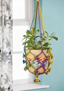 A lovely macrame hanging pot for your home, hand crafted from natural materials. 