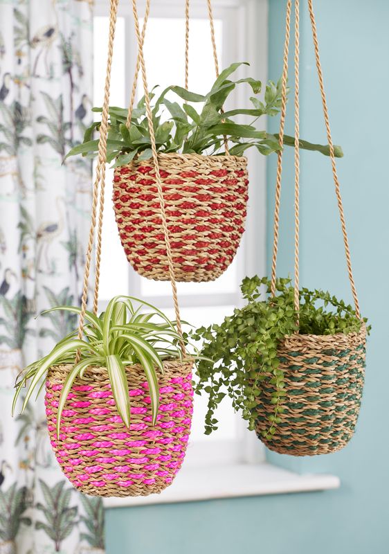 These hanging baskets are made from natural Hogla Grass and this set of three are finished in three different shades to add colour to your room.