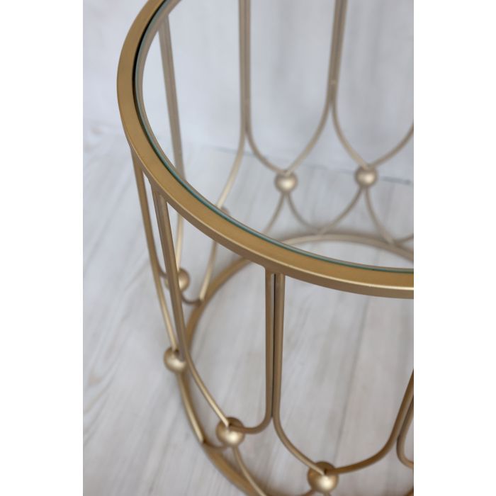 Side Table with Antique Brass Decorative loop and bauble design and glass top.  One large one small.
Close up of glass top