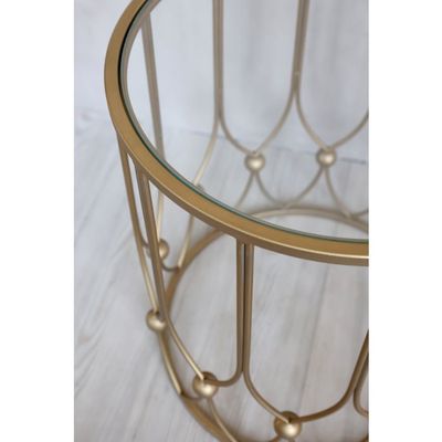Side Table with Antique Brass Decorative loop and bauble design and glass top.  One large one small.
Close up of glass top