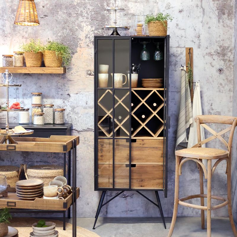A tall industrial-style drinks cabinet with a black metal frame, glass-panelled double doors, an internal wooden diamond wine