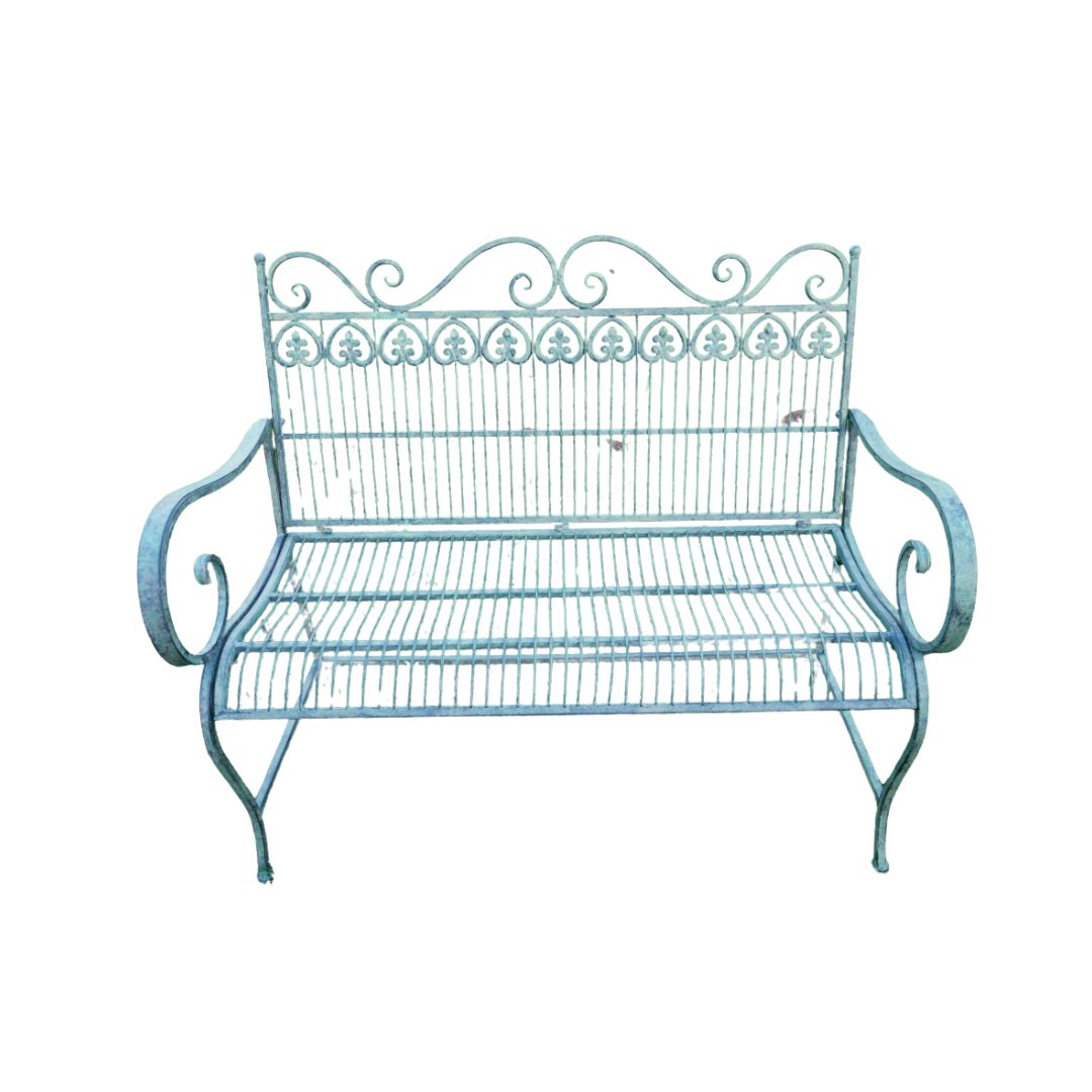 Wrought metal garden bench with decorative scrollwork and curved arms, finished in a soft vert patina.