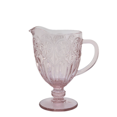 Spangles Fleur embossed glass jug in dusty pink, filled with a pale drink.