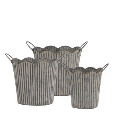 Set of three ribbed metal planters with scalloped rims and side handles, shown against a black background.
