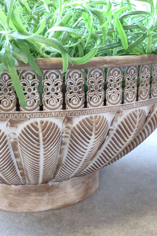 Set of two decorative metal bowls with engraved patterns, pedestal bases, and side handles