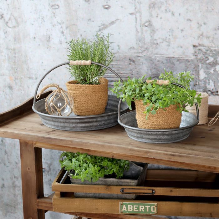 Shallow galvanised metal tray with two curved wire handles wrapped in wood.  Set on a Console Service Table