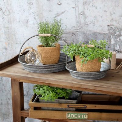 Shallow galvanised metal tray with two curved wire handles wrapped in wood. Set on a Console Service Table