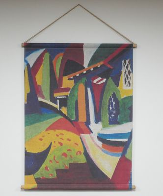 Fabric wall hanging showing a colourful abstract design with bold shapes and contrasting tones, printed on textured fabric.