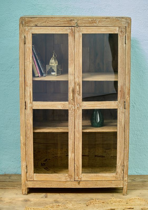 Wooden display cabinet with double glass doors and internal shelves, finished in a natural, lightly weathered wood tone.