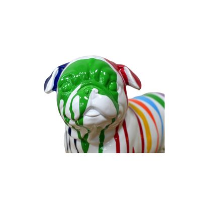 Front face view.
A lovely resin cast boxer dog in perfect clear white, with dripping paint stripes in a myriad of colours. 
Full view of dog standing on a shelf.