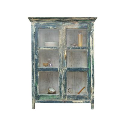 The Navi is a distressed teal coloured display cabinet standing at nearly five feet high.