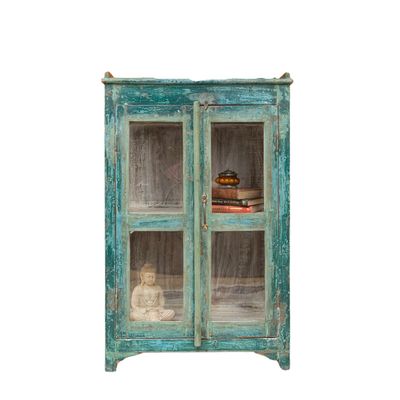 The Ajay Vintage Display Cabinet is finished in a distressed dark green and is floor standing.