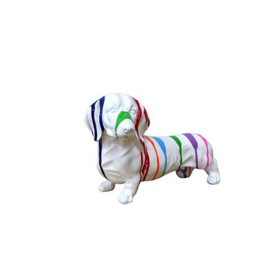 Don't you just love this little doggy. 
Made from resin in white finish but covered in stripes of all the colours of the rainbow. 
Front/ Side aspect close up image.
Height 12 cm