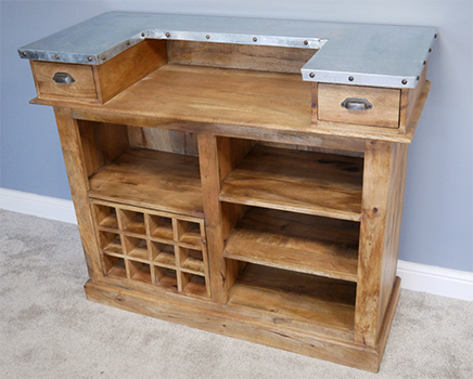 Behind the counter, for Landlords use only, are wine racks, three useful shelves, further shelf space for cans or glasses, and two drawers and a sunken countertop area for preparing drinks. 