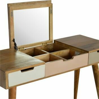 Blush pink dressing table with three shallow drawers in soft pink, white and sage green tones, natural wood frame.mirror