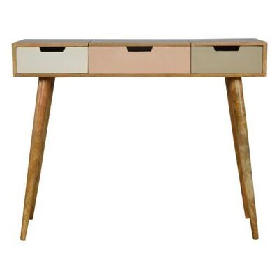 Blush pink dressing table with three shallow drawers in soft pink, white and sage green tones, natural wood frame