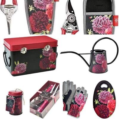 British Bloom Design - dark background with red, pink blooms.
Snips with holster, secateurs with holster, seed storage tin, indoor watering can, twine tin, hand trowel and fork, garden gloves and garden kneeler