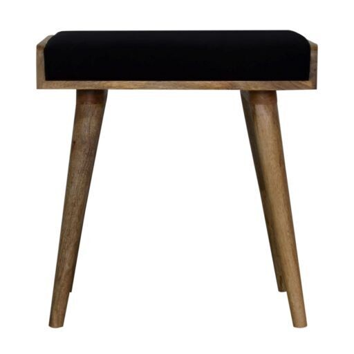A stylish footstool, with a black velvet seat pad, and made of solid Mango wood. The wood has been given an Oak effect finish which contrasts so well with the fabric. 
