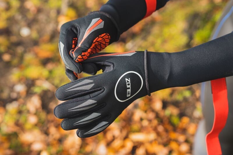 Zone3 Neoprene Swim Gloves
Black with Orange trim and white logos
Set outside