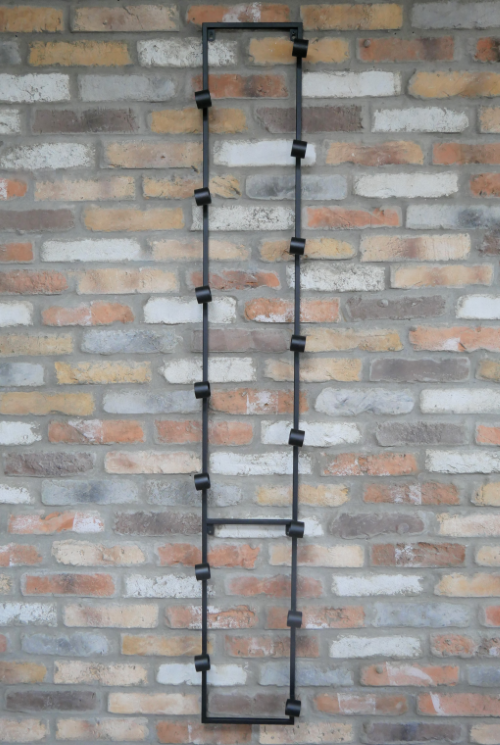 Edward wall-mounted metal wine rack holding bottles horizontally in a tall, space-saving design with an industrial finish.