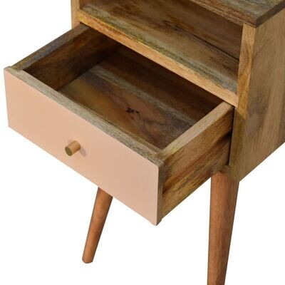 A useful opening drawer with a pink panelled front