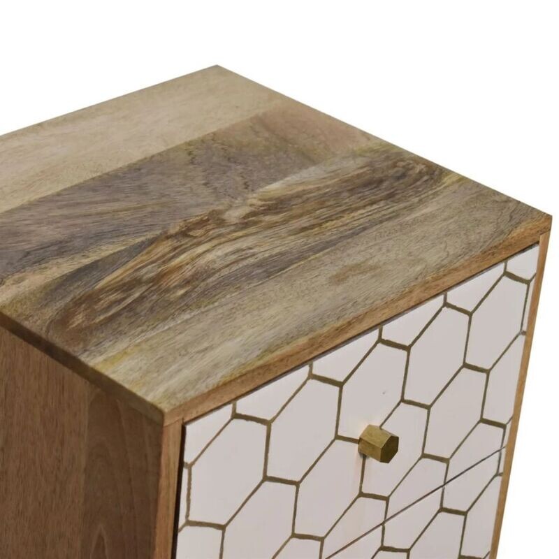Amelia bedside cabinet in natural wood tones with white painted frame and carved geometric pattern on the door