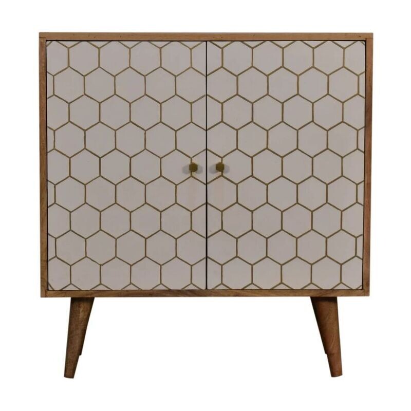 Wooden two-door cabinet with a white hexagonal patterned front, brass knobs, and tapered wooden legs.