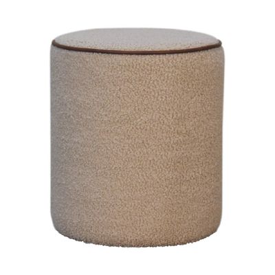 Cream bouclé round footstool with textured upholstery and stitched edge detail