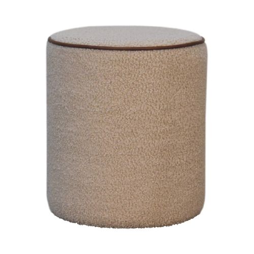 Cream bouclé round footstool with textured upholstery and stitched edge detail