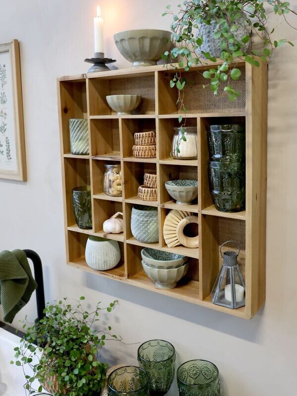 Here is one that has been wall mounted with a collection of pottery