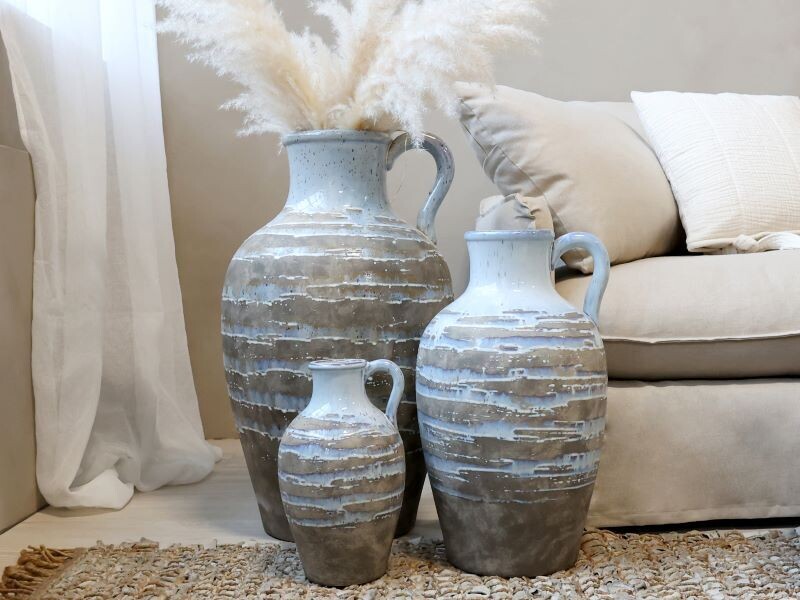 Breeze Vases
Light Blue/Opal Jug with Gold horizontal pattern
All Three - different Sizes situated in a home