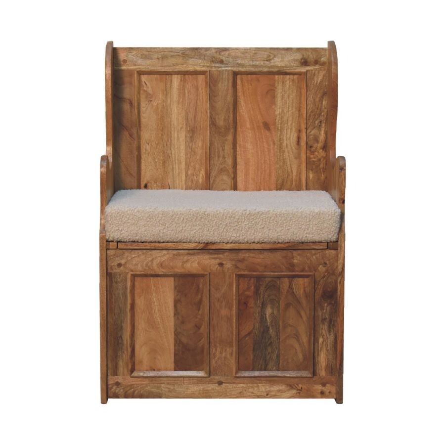 Boucle Cream Mini Monks Bench This mini Monks Bench is made from solid Mango wood and finished in an oak effect shade. It has been hand crafted, and finished with a cream boucle seat pad. It is a bit smaller than a usual monks bench, making it useful for those places where a larger unit just won't fit! Here we have a front view.