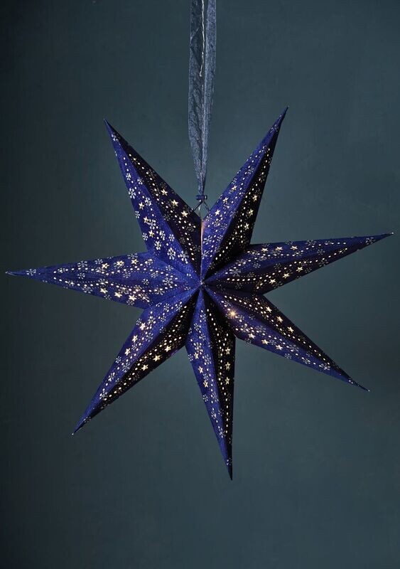 In a room setting, you can see the comforting glow from the star.