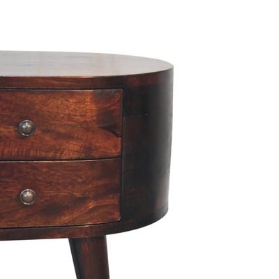 Two useful bedside drawers following the shapely contours of the cabinet