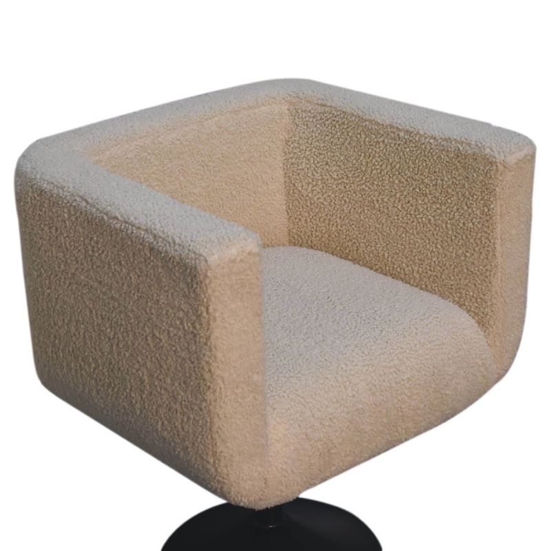An alternative side view of this comfortable and luxury swivel chair in cream boucle on a black swivel base. 