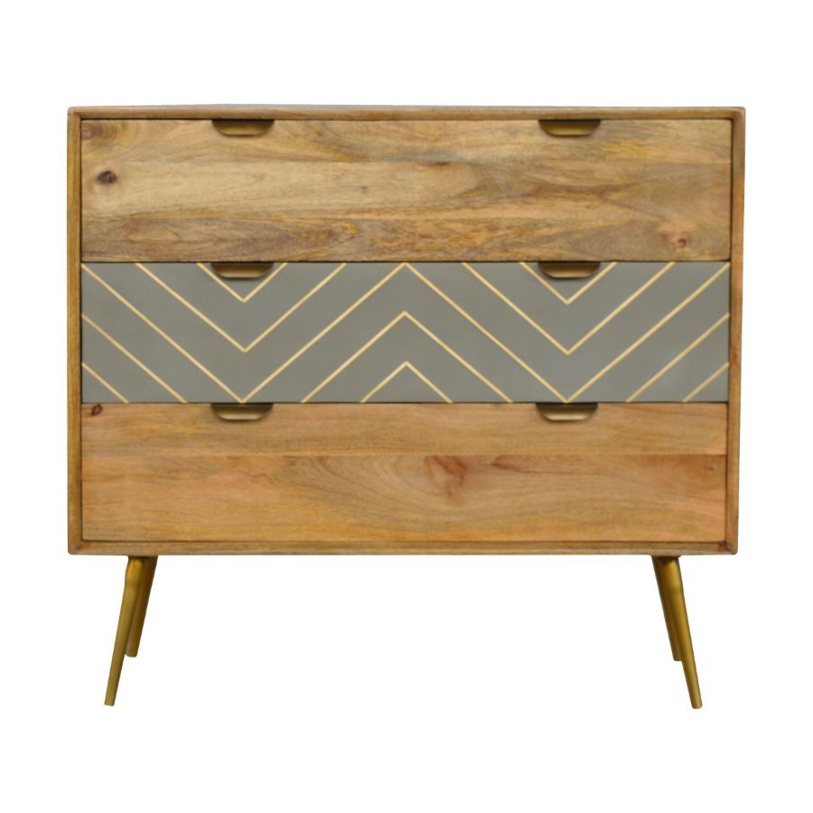 Cement Brass Inlay Chest of Drawers An attractive chest of drawers made from Mango wood, but with an oak finish. The central drawer has an eye catching cement design look