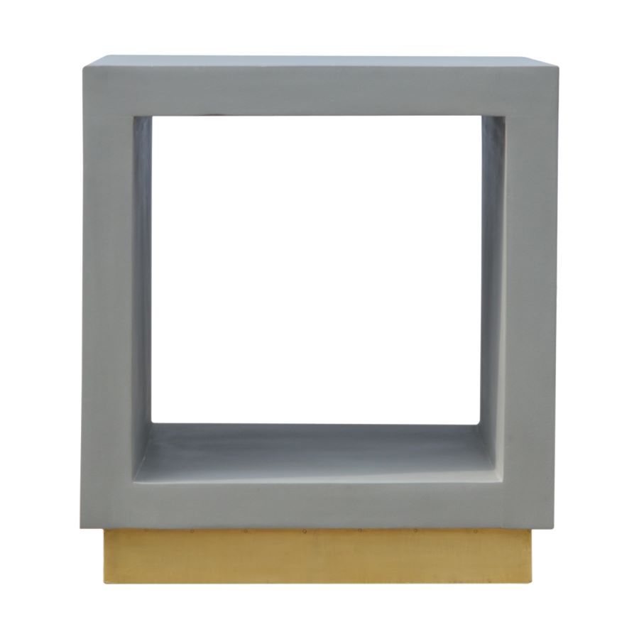 A contemporary bedside cabinet without any fiddly drawers- just an open space to store larger items. It is crafted with solid mango wood with a cement finish and a gold base. 