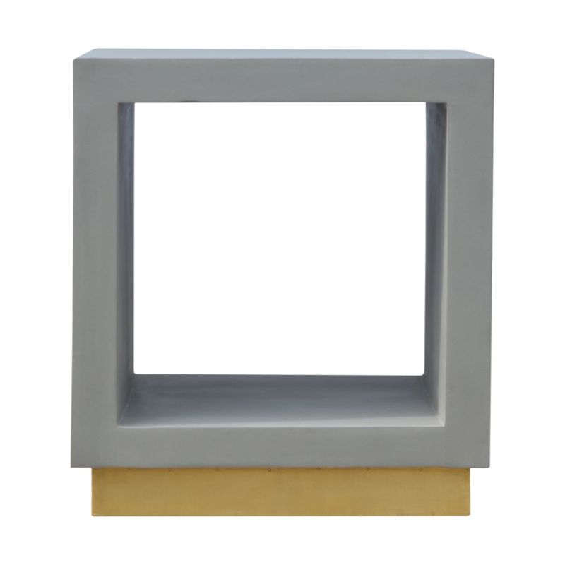 A contemporary bedside cabinet without any fiddly drawers- just an open space to store larger items. It is crafted with solid mango wood with a cement finish and a gold base. 