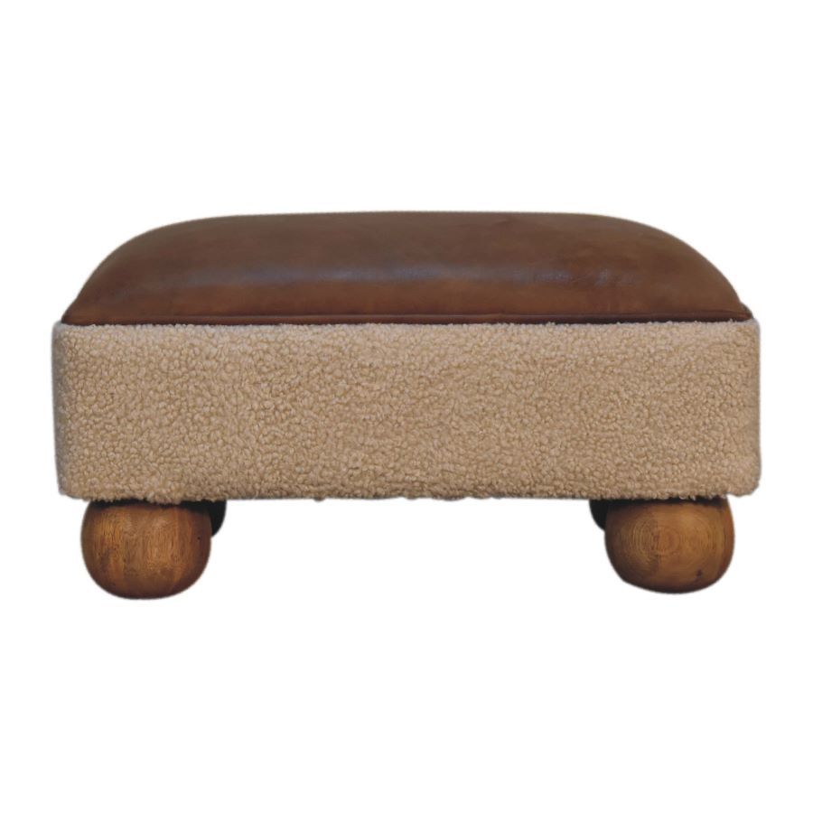 Boucle Tan Leather Ball Footstool This hand crafted footstool has tan and cream leathers combining perfectly with the oak effect feet, made from solid mango wood.