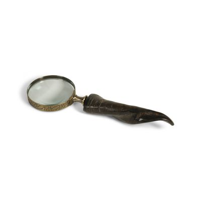 Curved Handle Magnifier A rather special magnifier with a horn handle and a brass rimmed magnifying glass which is so useful for reading those hard to make out prints.