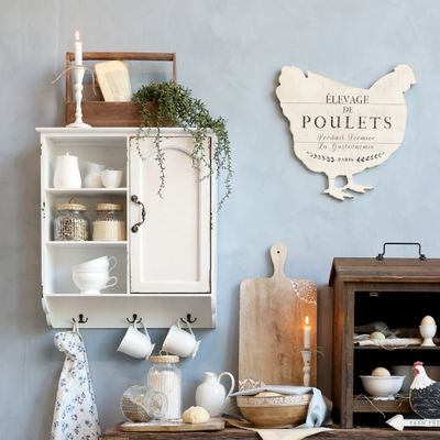 Beautiful and practical. This lovely Jolie cabinet has an opening door and an open shelf display area. Below the cupboard and shelf are hangers, ideal for cups, mugs, keys or anything else that can go on a hook!
It is made of fir wood, MDF, plywood and iron. 
Cream finish. Size 61 x56 x19 cm
Shown here in a room setting.