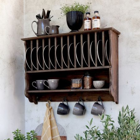 Cuisine Plate Rack.
Recycled natural finish wooded wall mounted plate rack with four hooks.
Set on stone wall and dressed with plates and mugs hanging from hooks