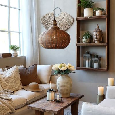 Kai Rattan Light in a lifestyle setting.
Lifestyle setting: Beige, Earthy Toned Room with Grimaud WAll Display Shelf and Grimaud Coffee Table. Marseilles cream linen sofa and armchair.
