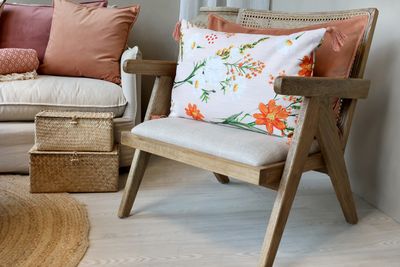 Chic Rectangular Patterned Cushion with Corner Tassels.
Pinks, Taupe, Peach Floral Design
Set on a Loung Cosy Chair