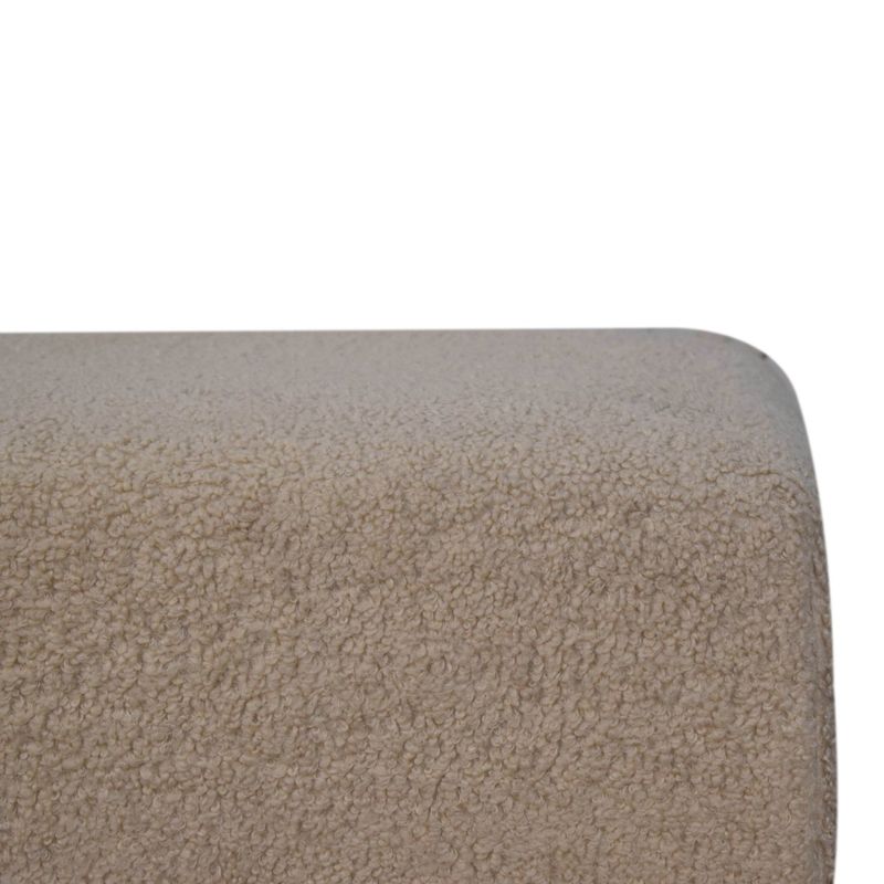 A good solid footstool finished in a cream boucle fabric