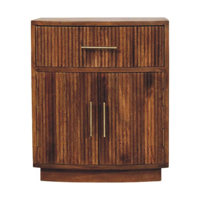 Wooden bedside cabinet with one top drawer, two-door cupboard, fluted front panels, and brushed metal handles.