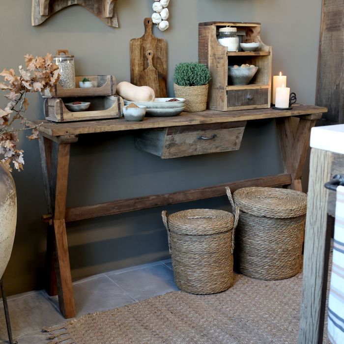 Rustic recycled wood console table with one drawer, tapered legs and a natural weathered finish.