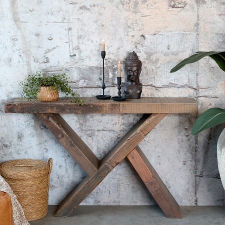 Rustic recycled repurposed wooded console table made from with simple planks and crossed, weathered timber legs.