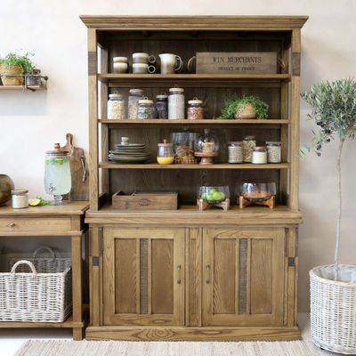 Wooden dresser with a classic design, featuring multiple drawers for storage & a timeless, elegant finish.